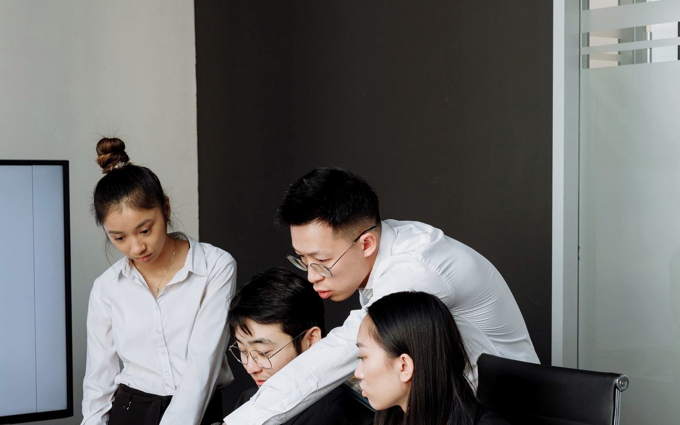 A team reviewing a project together on screen